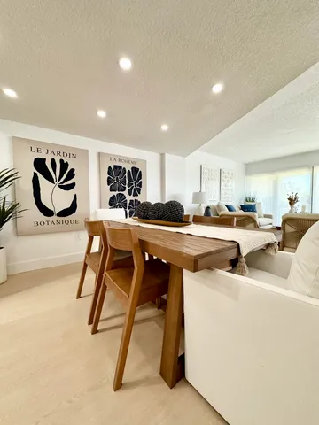 a view of kitchen with stainless steel appliances kitchen island