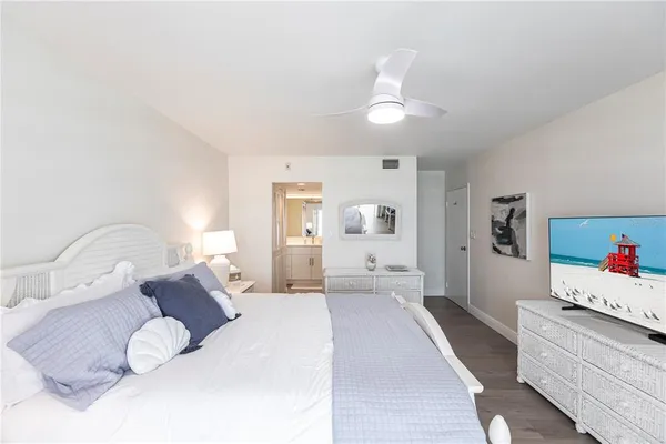 a bedroom with a bed and a couch