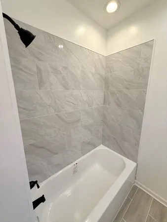 a bathroom with a sink mirror vanity and toilet