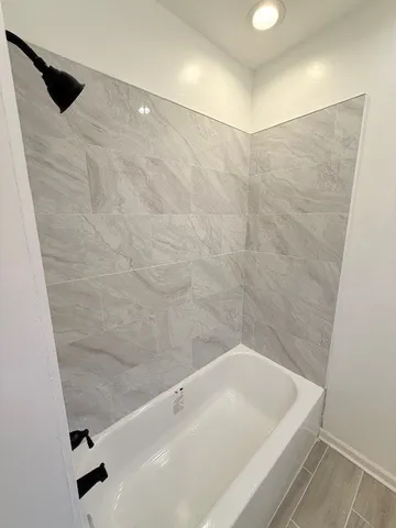 a bathroom with a sink mirror vanity and toilet
