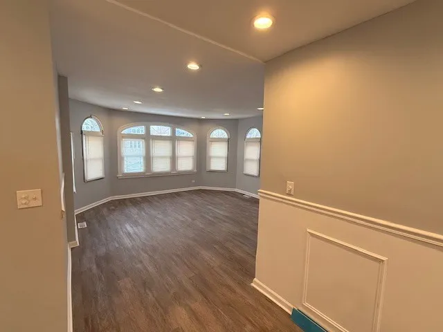 a view of a livingroom with wooden floor
