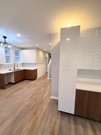 a view of kitchen and wooden floor