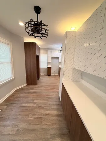 a kitchen with a sink stainless steel appliances and cabinets