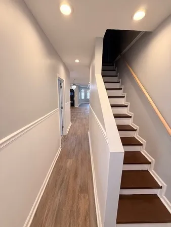 a view of entryway with wooden floor