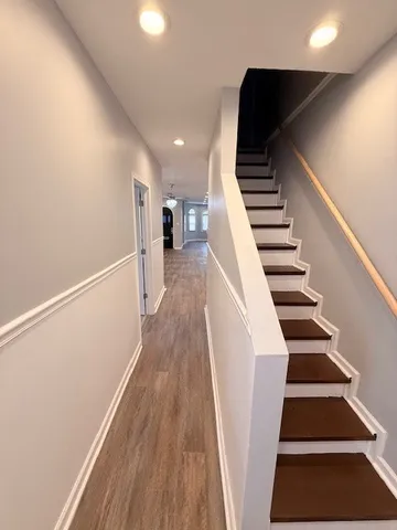 a view of entryway with wooden floor