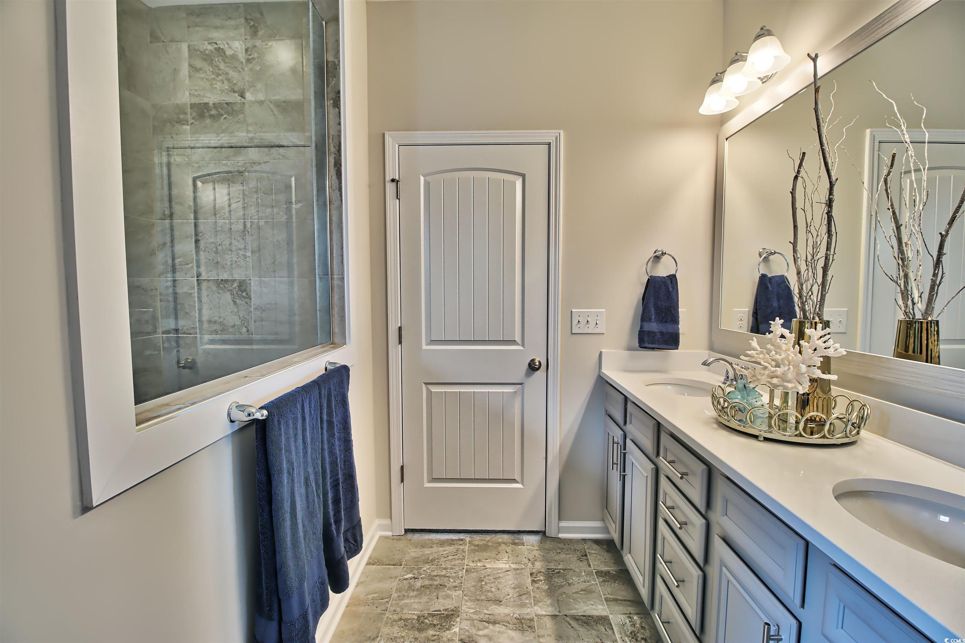 1028 Log Cabin Road Loris, SC 29569 - Photo 32 of 36 Bathroom with tile patterned floors and dual bowl