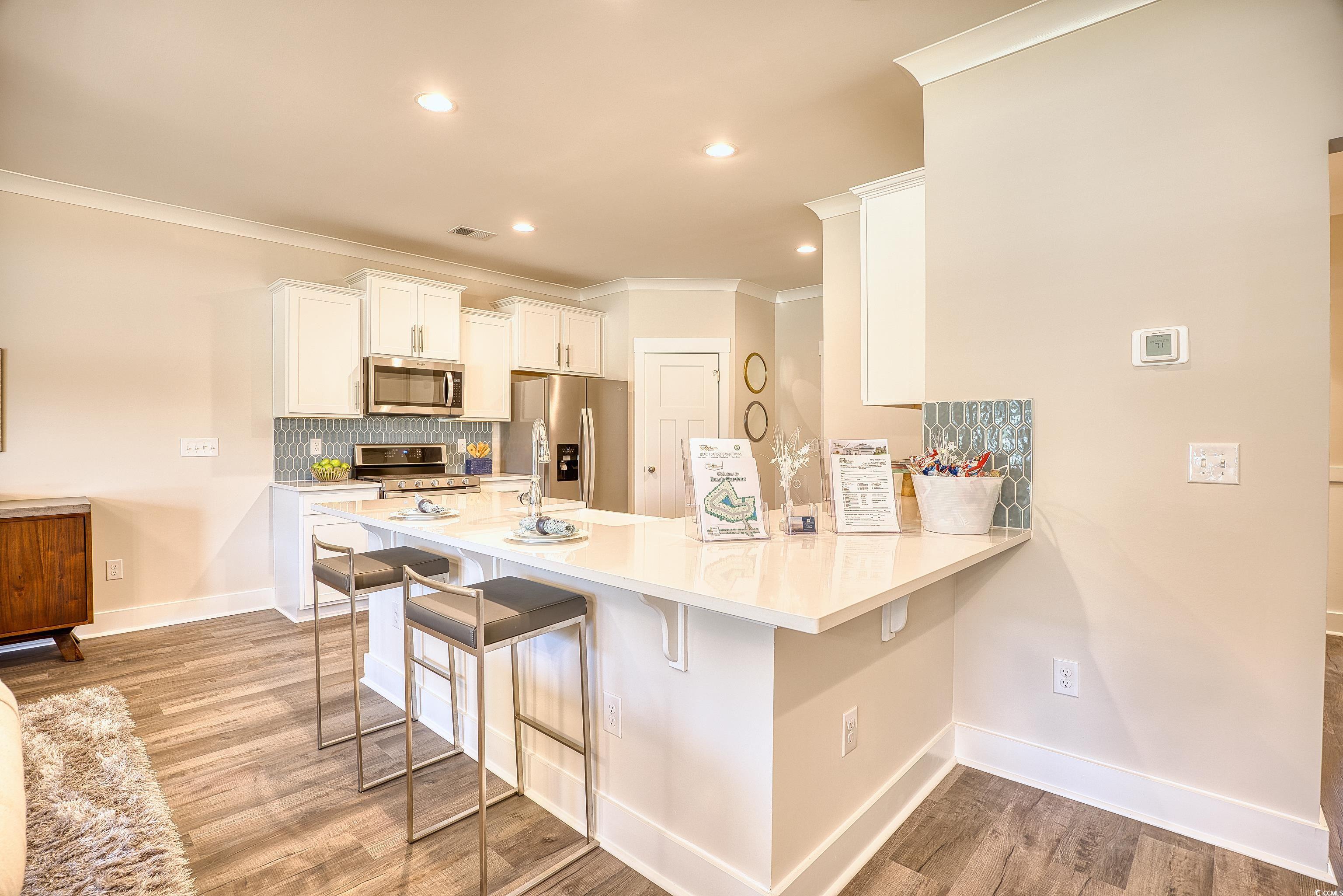 1028 Log Cabin Road Loris, SC 29569 - Photo 8 of 36 Kitchen with white cabinetry, stainless steel appl