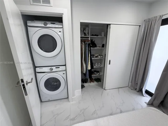 a utility room with dryer and washer