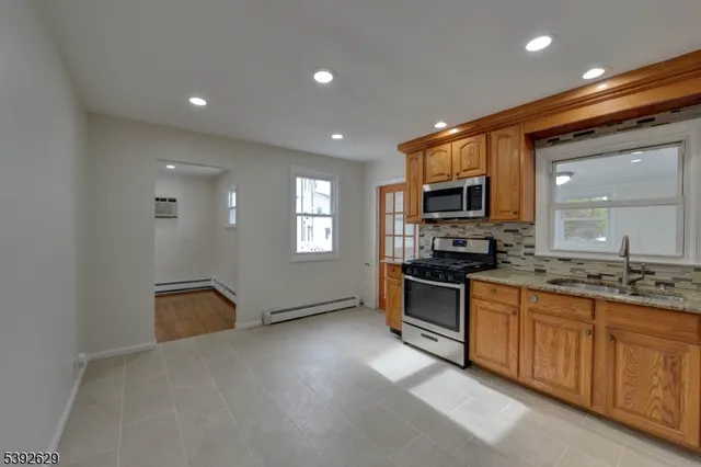 a view of a refrigerator in kitchen