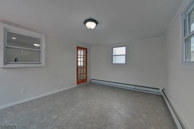 a bathroom with a sink toilet and a mirror
