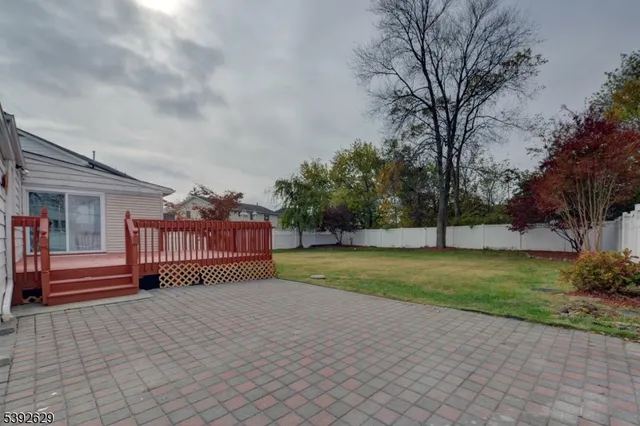 a view of deck with wooden floor and fence