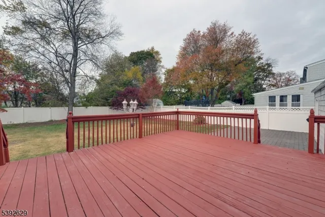 a view of a house with wooden deck