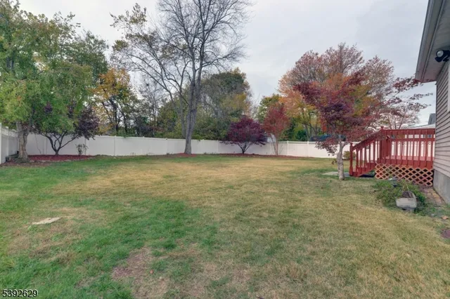 an aerial view of a house with outdoor space