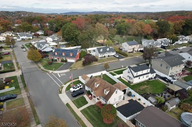 an aerial view of a house with a swimming pool