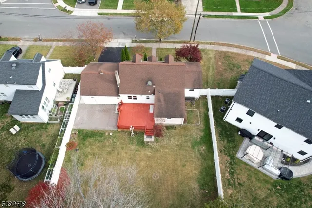 an aerial view of a house with a swimming pool