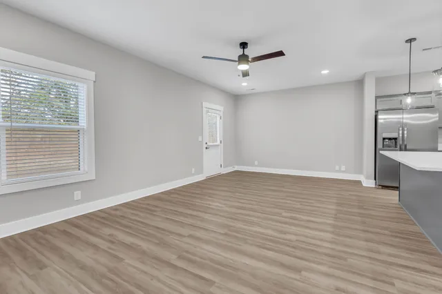 a kitchen with kitchen island a sink stainless steel appliances and cabinets
