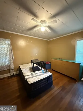 a living room with hard wood flooring