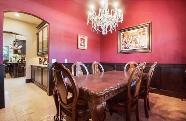 a spacious bedroom with a bed and glass door