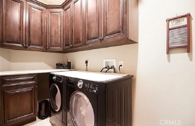 a bathroom with a granite countertop toilet a sink and a mirror