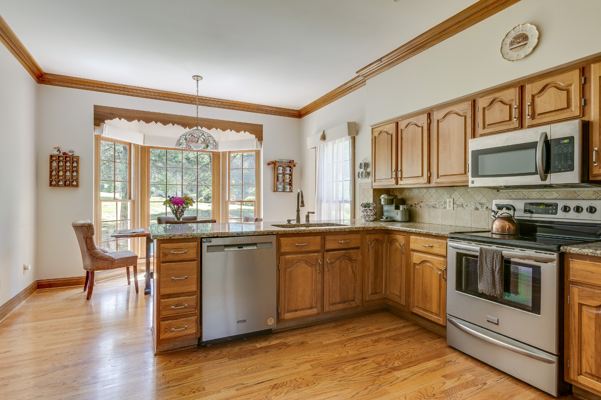 1111 Temple Ridge Court Nashville, TN 37221 - Photo 16 of 46 a kitchen with stainless steel appliances granite countertop a stove and a sink