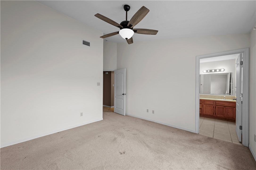 501 Jane Street Corpus Christi, TX 78418 - Photo 21 of 39 an empty room with a ceiling fan and window