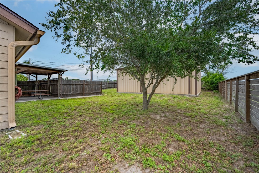 501 Jane Street Corpus Christi, TX 78418 - Photo 34 of 39 a view of a house with backyard and a tree