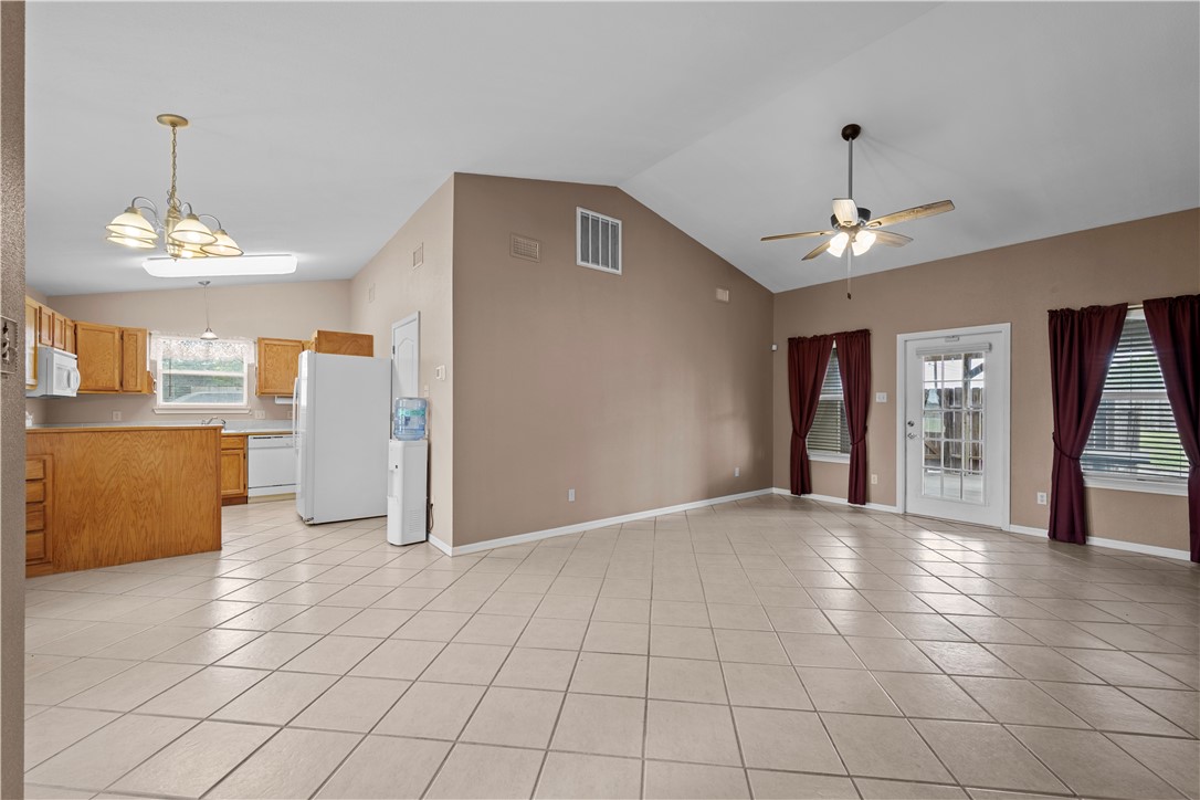 501 Jane Street Corpus Christi, TX 78418 - Photo 6 of 39 a view of a kitchen with cabinet and a chandelier