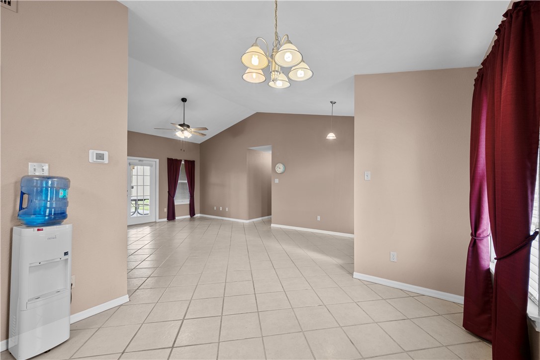 501 Jane Street Corpus Christi, TX 78418 - Photo 7 of 39 a view of a hallway with chandelier and dining area
