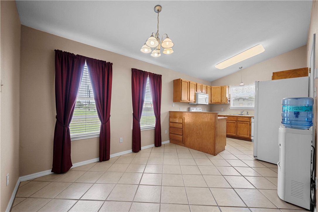 501 Jane Street Corpus Christi, TX 78418 - Photo 8 of 39 a kitchen with stainless steel appliances granite countertop a refrigerator and a sink