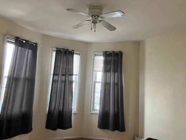 a view of a hallway with windows