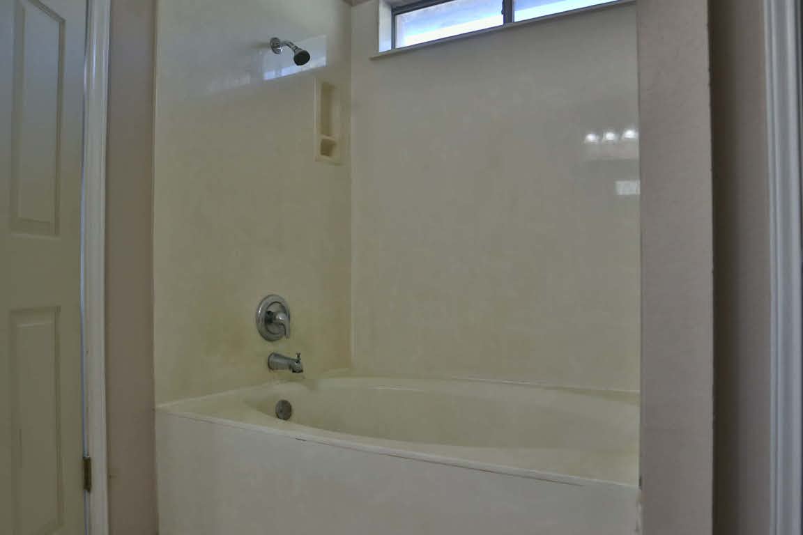 717 Blair Avenue Bastrop, TX 78602 - Photo 16 of 27 Bathroom featuring bathing tub / shower combination