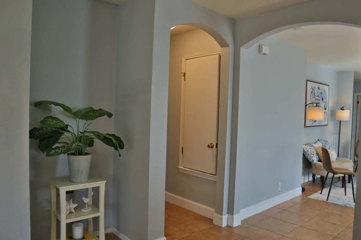 717 Blair Avenue Bastrop, TX 78602 - Photo 23 of 27 Corridor featuring light tile patterned floors and arched walkways