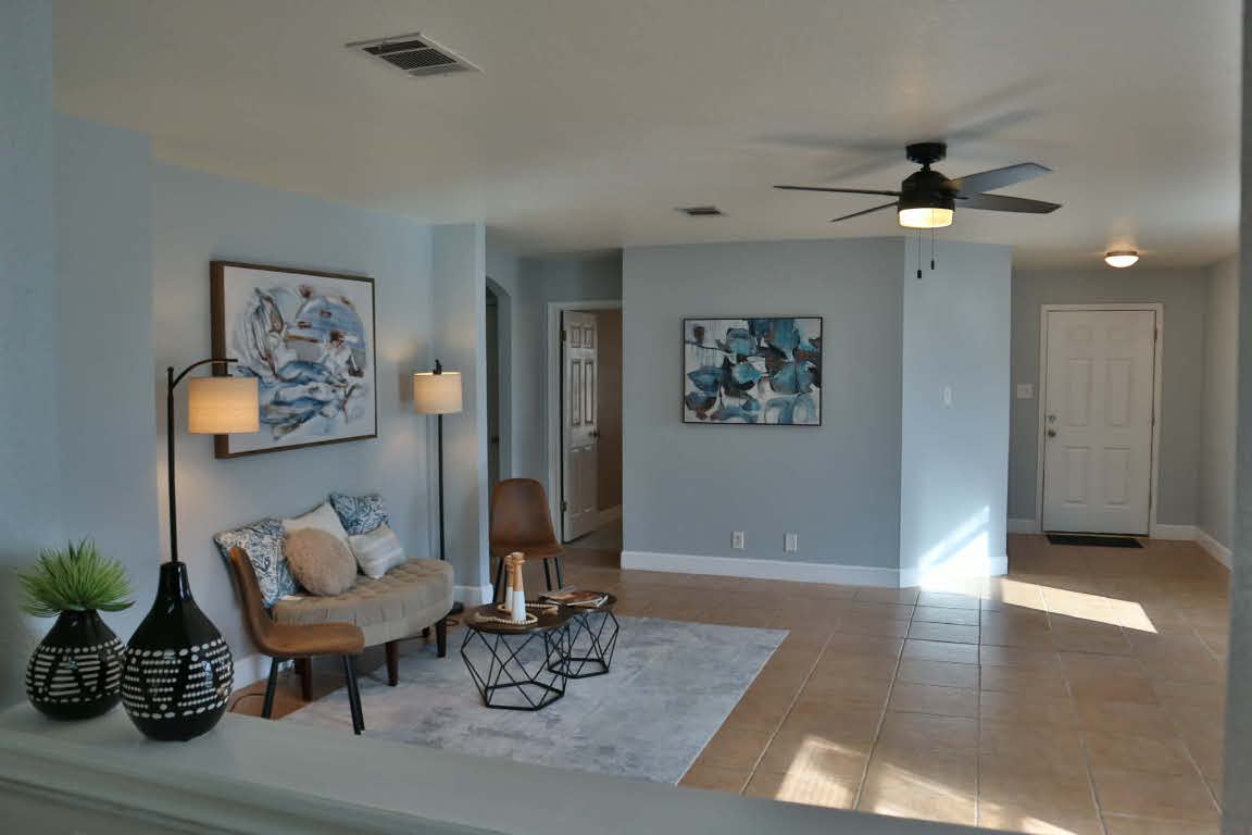 717 Blair Avenue Bastrop, TX 78602 - Photo 3 of 27 Living area with ceiling fan and light tile patterned floors