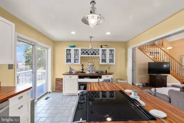 a kitchen with stainless steel appliances granite countertop a stove and a sink