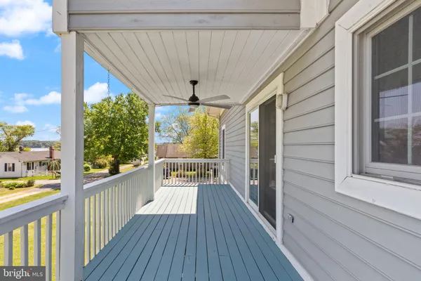 a bedroom with a bed and a mirror