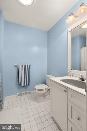 a bedroom with furniture and a wooden floor