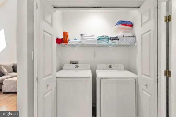 a bedroom with bed and wooden floor