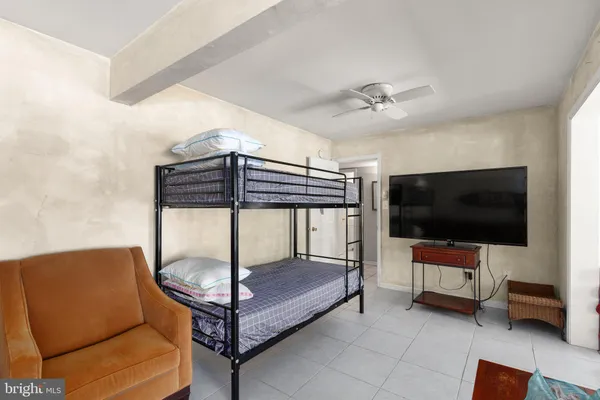 a swimming pool with outdoor seating and barbeque oven