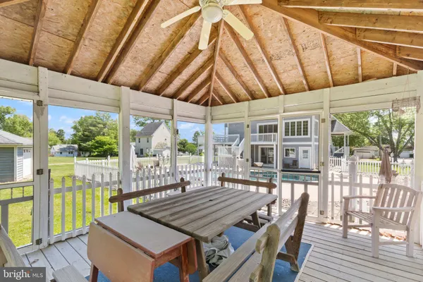 an aerial view of a house with swimming pool garden and patio