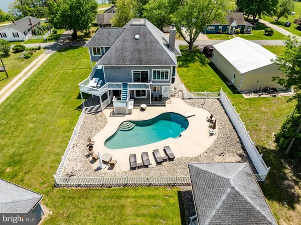 a view of a lake with houses in the back