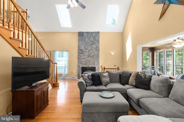 a living room with fireplace furniture and a flat screen tv