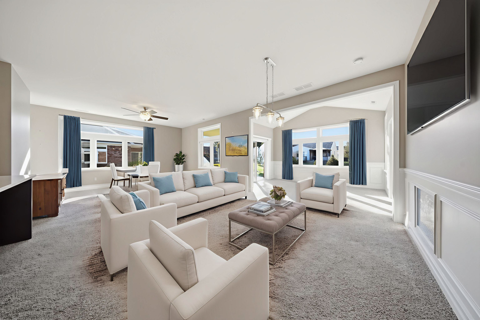 437 Stearn Drive, Unit 437 Genoa, IL 60135 - Photo 11 of 50 a living room with furniture and a chandelier