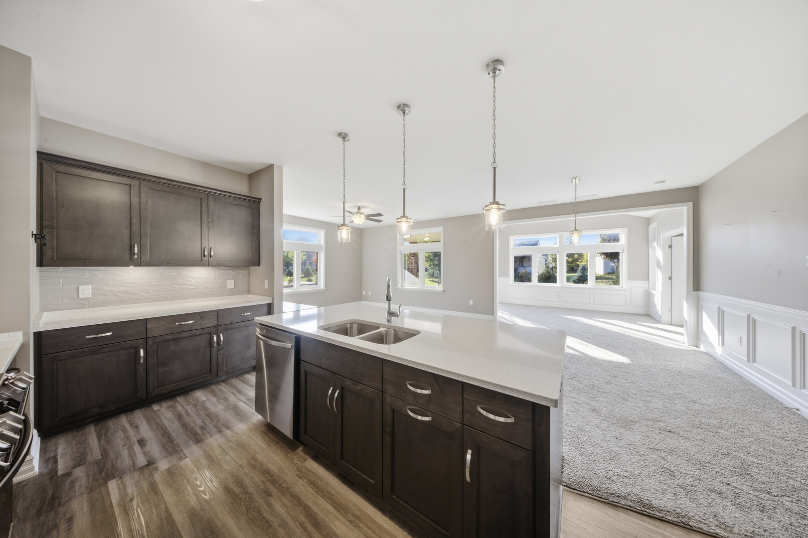 437 Stearn Drive, Unit 437 Genoa, IL 60135 - Photo 16 of 50 a kitchen with a sink stove and microwave