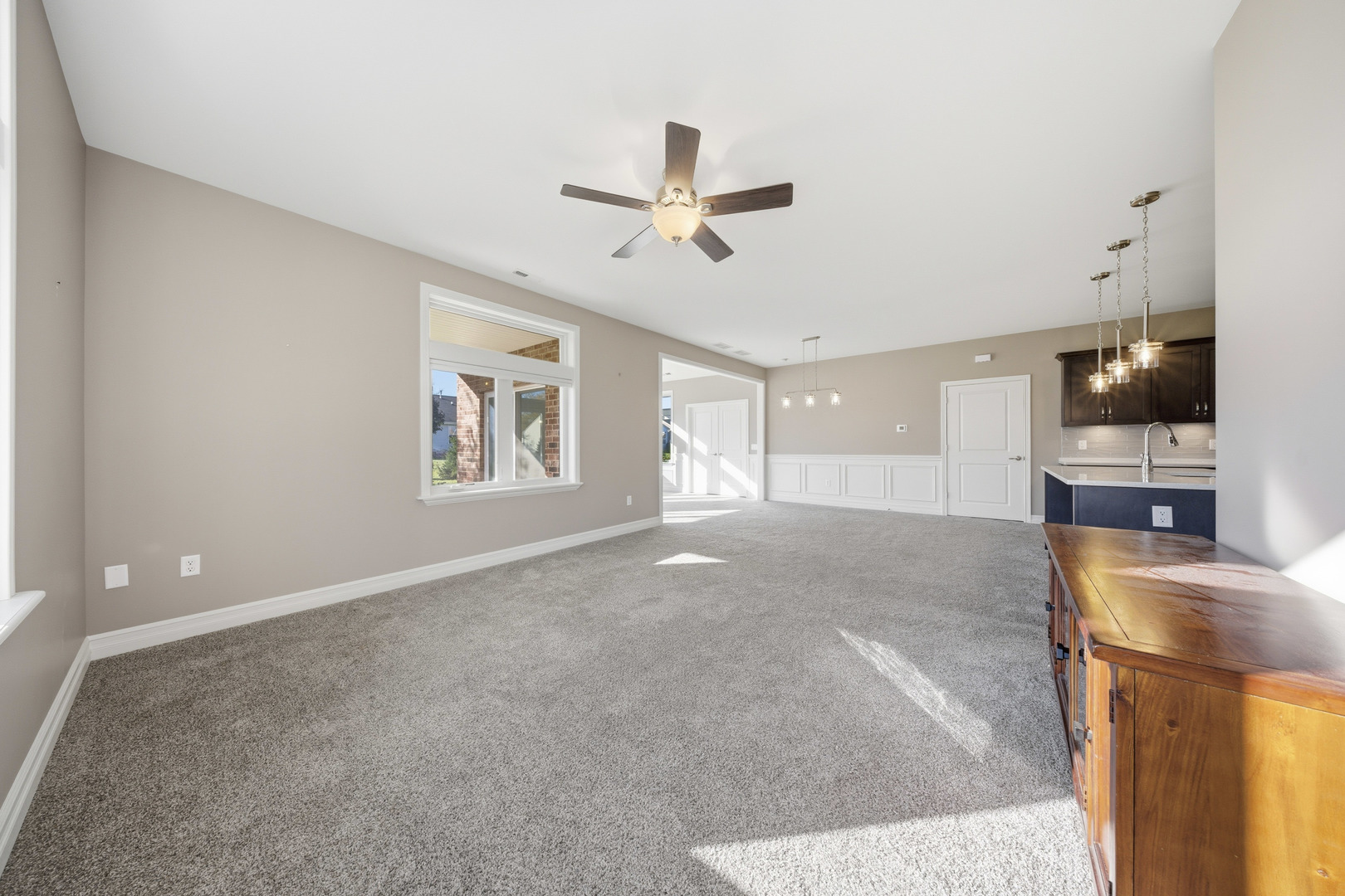 437 Stearn Drive, Unit 437 Genoa, IL 60135 - Photo 19 of 50 a view of a livingroom with a flat screen tv
