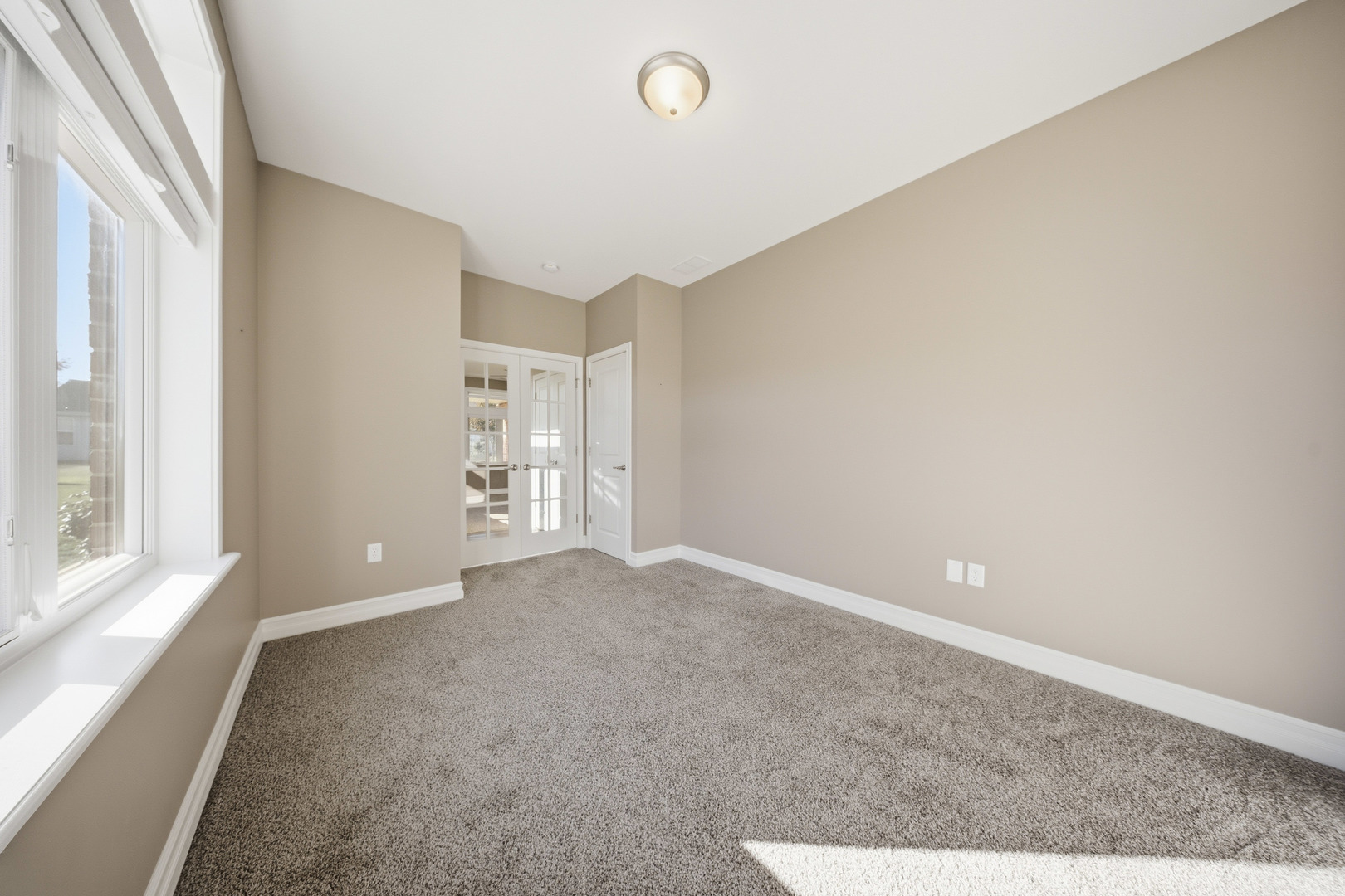 437 Stearn Drive, Unit 437 Genoa, IL 60135 - Photo 23 of 50 a view of an empty room with a window