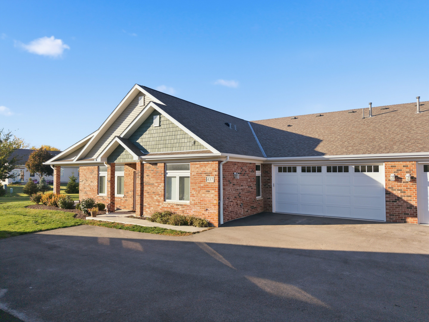 437 Stearn Drive, Unit 437 Genoa, IL 60135 - Photo 3 of 50 front view of a house with a yard