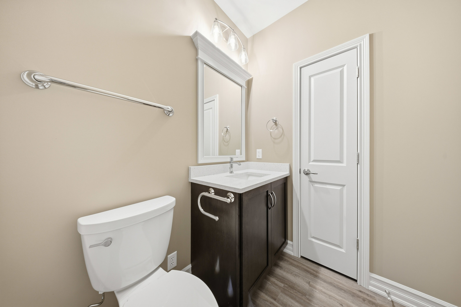 437 Stearn Drive, Unit 437 Genoa, IL 60135 - Photo 34 of 50 a bathroom with a toilet sink and mirror