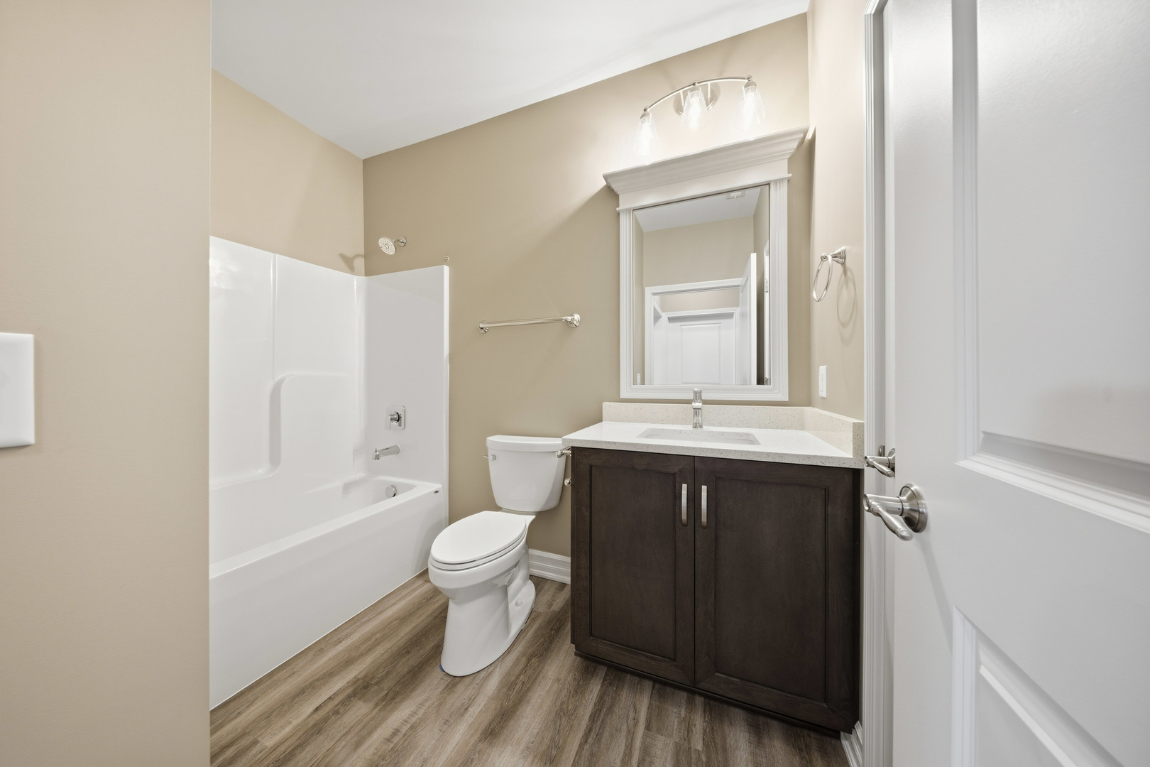 437 Stearn Drive, Unit 437 Genoa, IL 60135 - Photo 35 of 50 a bathroom with a sink vanity toilet and shower