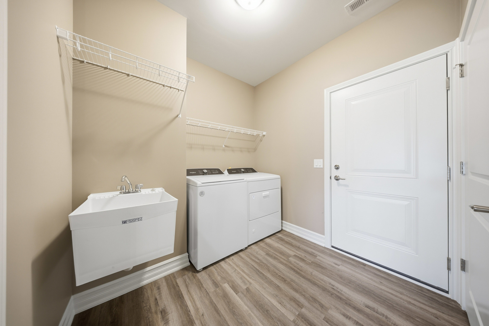 437 Stearn Drive, Unit 437 Genoa, IL 60135 - Photo 36 of 50 a view of utility room with washer and dryer