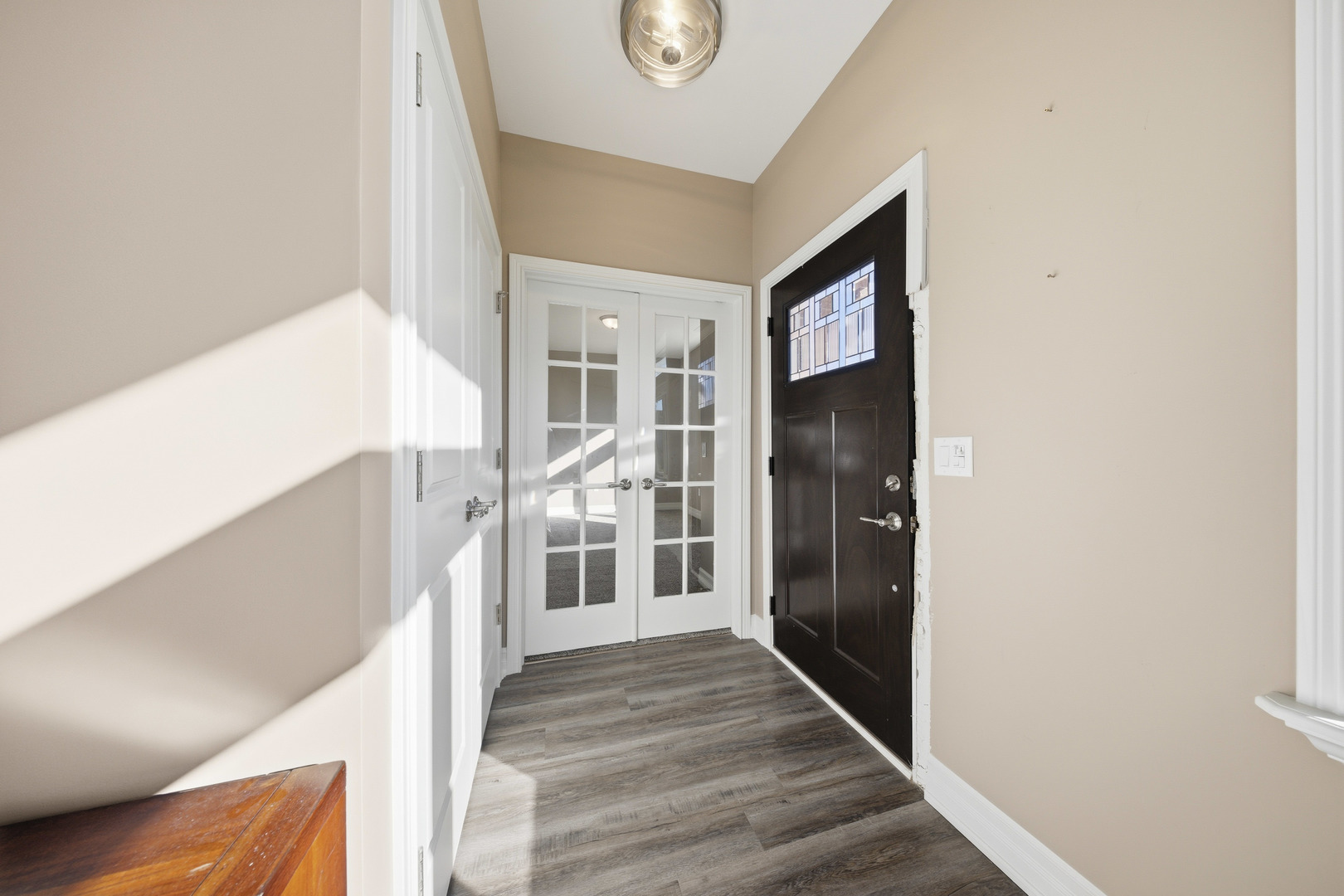 437 Stearn Drive, Unit 437 Genoa, IL 60135 - Photo 5 of 50 a view of a hallway view with wooden floor and staircase